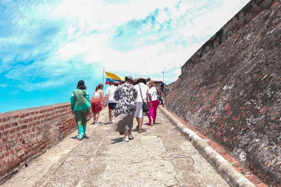 Cartagena: BILINGUAL CITY TOUR San Felipe Castle & Old city - Old Town walk: Clock Tower to the lanes that feel lived-in