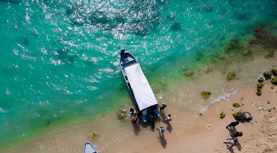 Cartagena: Tour to Playa Tranquila with Snorkeling + Luminous Plankton and Parasol - Playa Tranquila beach time: lunch, chairs, and real free hours