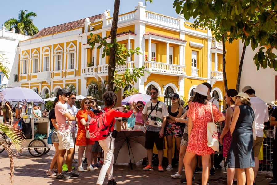 Shared Cartagena Old City Tour with Wireless Audio System - First gates: Torre del Reloj and the entrance street vibe