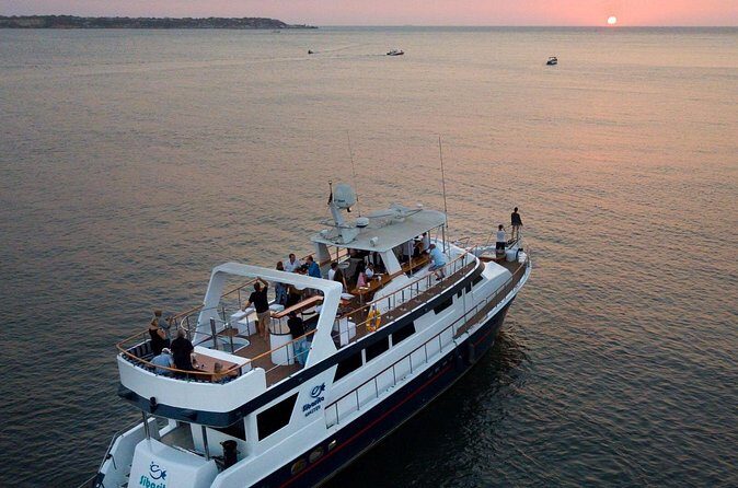 Sunset in Catamaran by Cartagena Bay - The return glide: Cartagena’s walled city lit from the sea