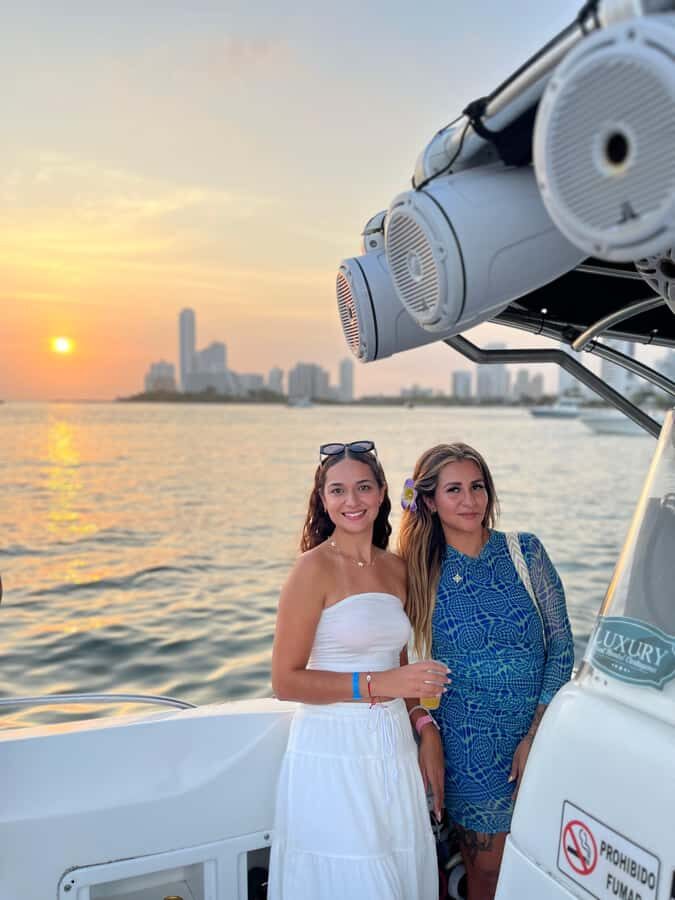 Sunset Party open bar on the bay while sharing with locals - The cruise flow: photo stops, bay views, then sunset